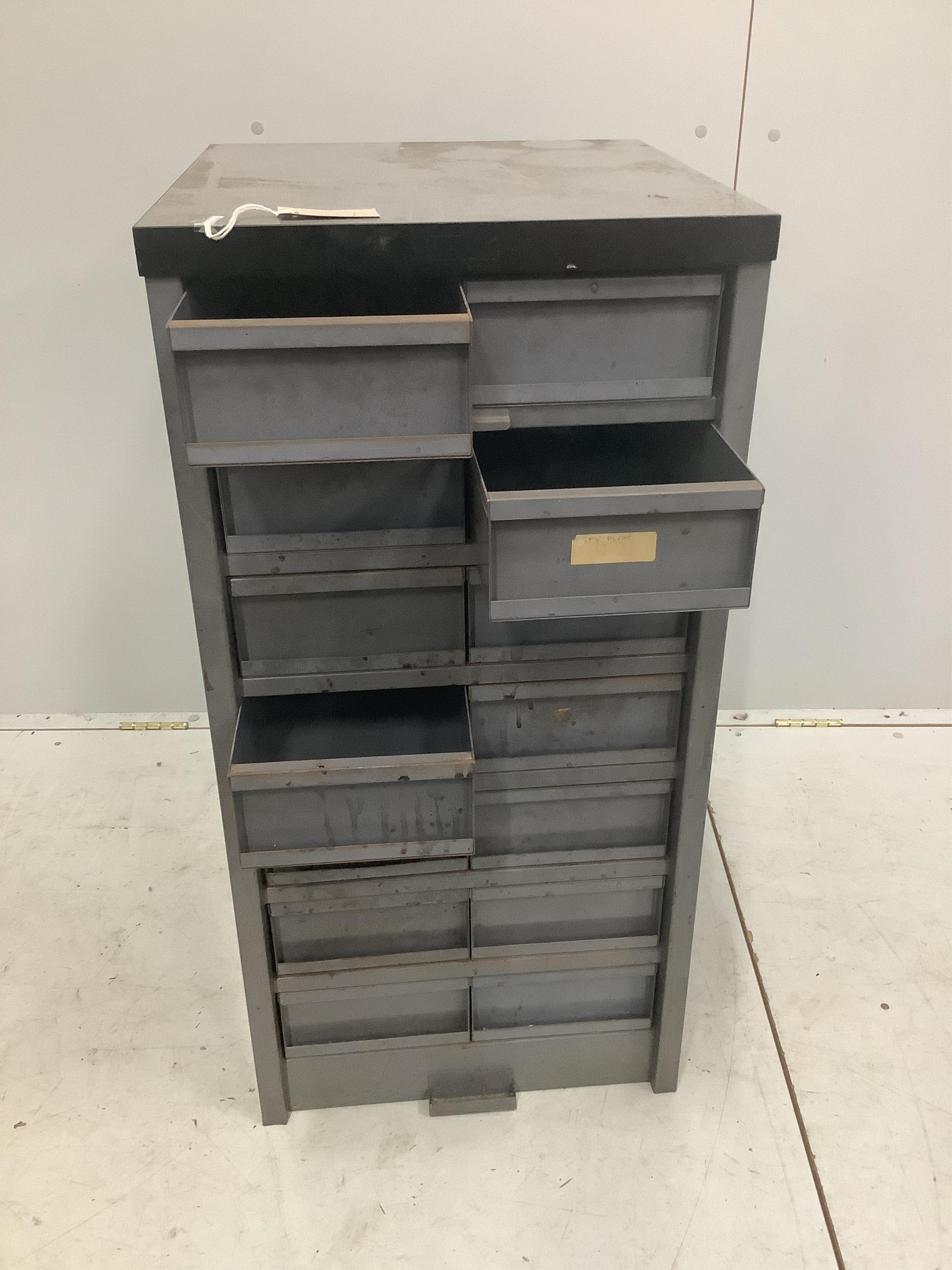 An industrial metal fourteen drawer tall chest, width 45cm, depth 48cm, height 92cm. Condition - fair